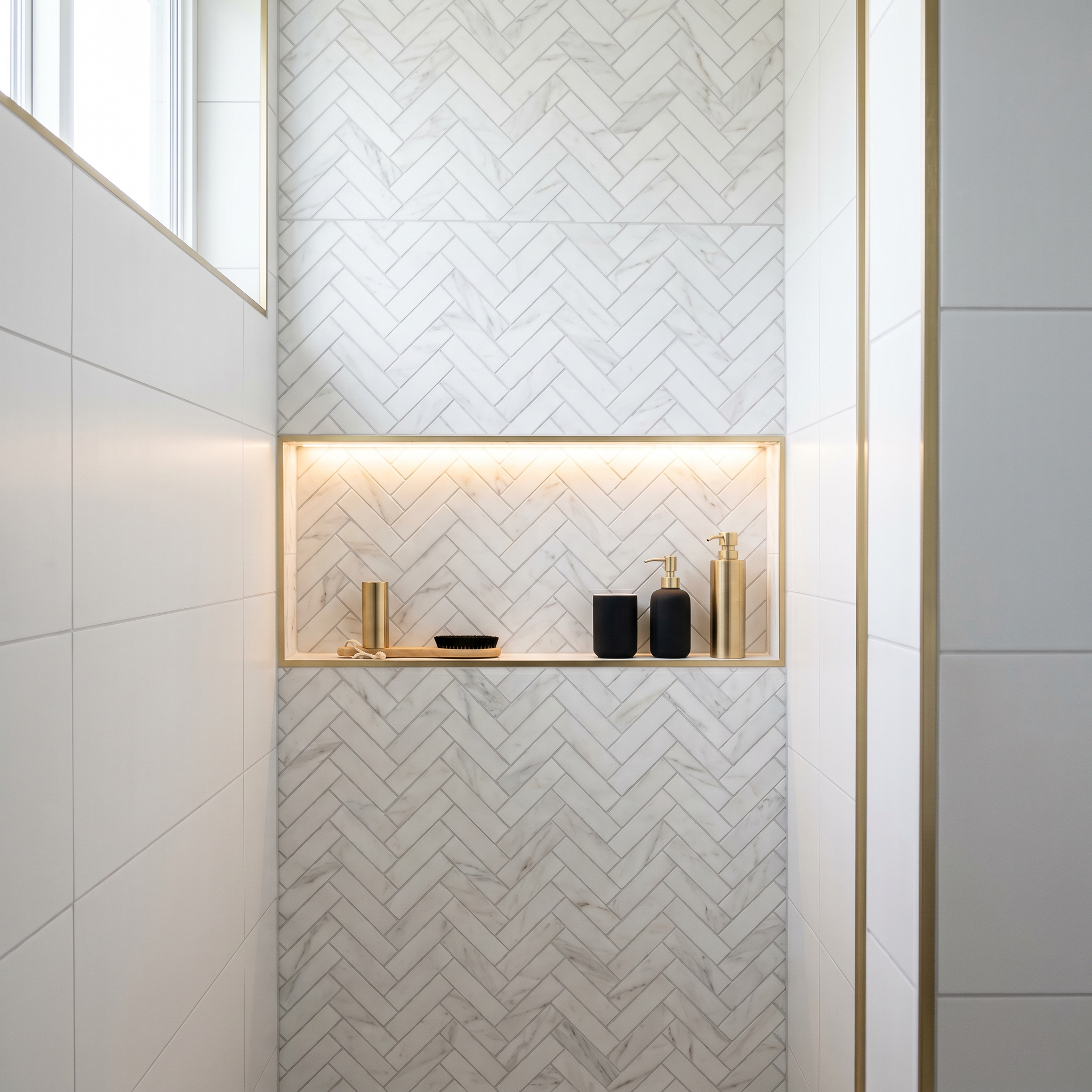 Herringbone shower tile installation in Ottawa by Dream Living Construction